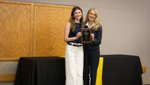 Grace Lisi, left, received the "Top Student Overall" plaque from Dean Sandra Vannoy. Photo by Sabrina Cheves