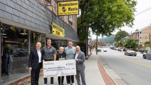 Pictured, from left to right, are App State Vice Chancellor of University Advancement Will Sears, Adam Scherer ’01, Mountaineer Mania general manager Anna Powell, Reese Raulston, a sophomore electronic media/broadcasting major from Mooresville and Mountaineer Mania employee, and App State Chief Operating Officer and Executive Vice Chancellor J.J. Brown. Appalachian State University has received significant support from alumni Scherer and Preston Powell ’01, co-owners of the Mountaineer Mania team store on K
