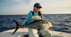 Sophomore, Kaela Sosa holding a yellow fin tuna she caught. 
