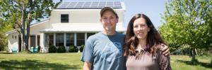 The Westermans in front of their home, which holds 50 solar panels and generates enough power for their family of four, with extra to share. The Westermans in front of their home, which holds 50 solar panels and generates enough power for their family of four, with extra to share.