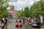 Oudezijds Voorburgwal canal with St. Nicholas in the background; Amsterdam
